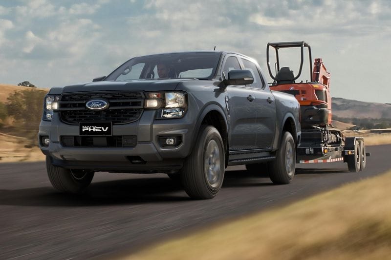 Ford admits customers will share the cost of potential fines under Australia's new emissions laws.